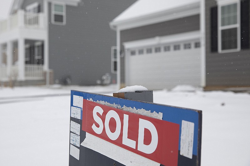 A sold sign is displayed outside a new home at the Toll Brothers Inc. Bowes Creek Country Club community in Elgin, Ill, on Jan. 23, 2020. (Bloomberg photo by Daniel Acker.)