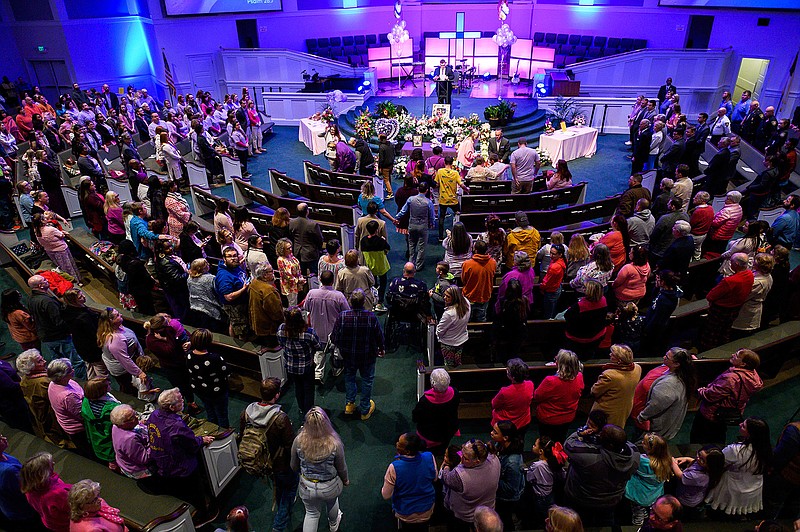 People stand as family of six-year-old Faye Swetlik enter the chapel for her remembrance service at Trinity Baptist Church in Cayce, S.C., Friday, Feb. 21, 2020. (Josh Morgan/The Greenville News via AP)