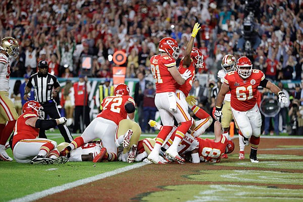The Chiefs celebrate after scoring a touchdown against the 49ers during Super Bowl LIV in Miami Gardens, Fla.a