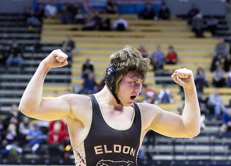 Kaden Dillon of Eldon raises his arms in victory Saturday after defeating Trevor Campbell of Harrisonville in the 195-pound title match at the Class 2 state wrestling championships at Mizzou Arena. Dillon won by a 5-2 decision.