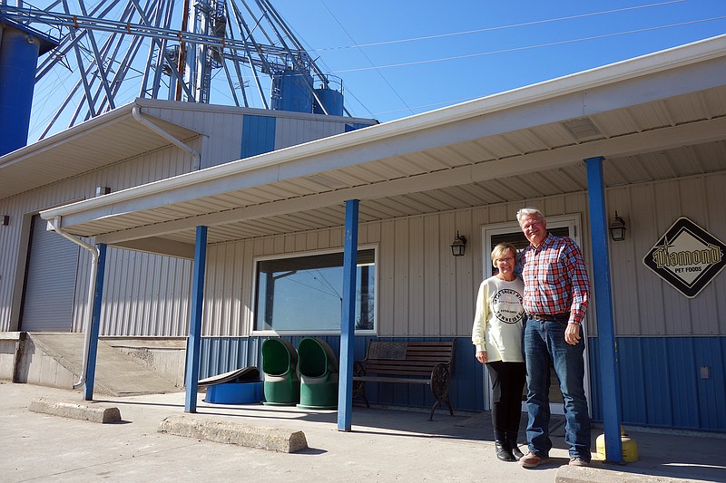 Kenny Twillman, right, is the owner of Twillman Feed Service and the recipient of this year's Kingdom of Callaway Supper Settler's Award. He and his wife, Lori, pose Friday outside the TFS Calwood location.