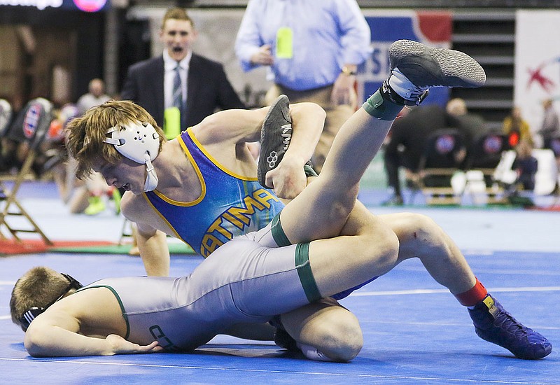 Lucas Laux of Fatima pushes down Logan Ferrero of Whitfield during Saturday's 126-pound title match at the Class 1 state wrestling championships at Mizzou Arena. Laux won by a 4-3 decision.