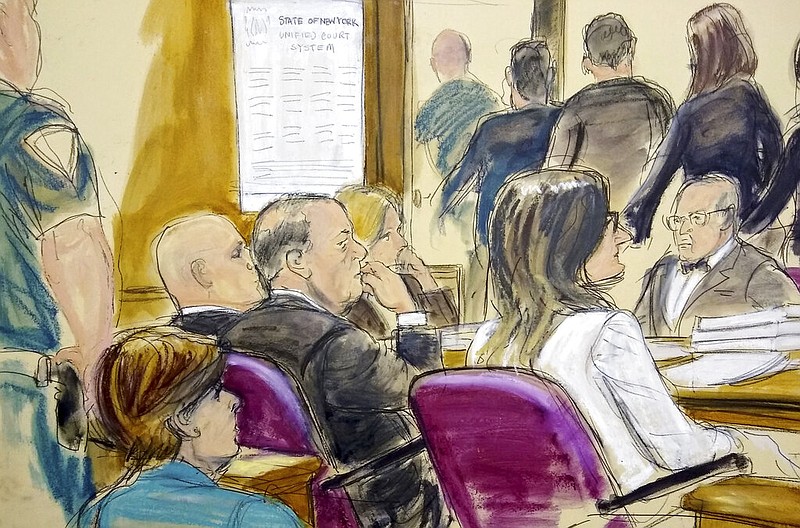 In this courtroom drawing, Harvey Weinstein, center, sits at the defense table surrounded by his attorneys as jurors file out of the courtroom after being told by the judge to go back and keep deliberating in Weinstein's rape case, Friday, Feb. 21, 2020, at Manhattan Supreme Court in New York. Earlier they sent out a note saying they were deadlocked on two charges. Attorney Gloria Allred, foreground left, is seated in the gallery behind Weinstein. (Elizabeth Williams via AP)