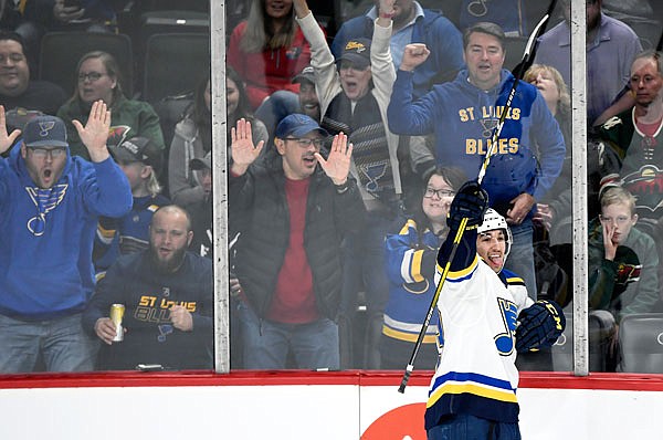 Jordan Kyrou of the Blues celebrates scoring a goal against the Wild during the first period of Sunday's game in St. Paul, Minn.
