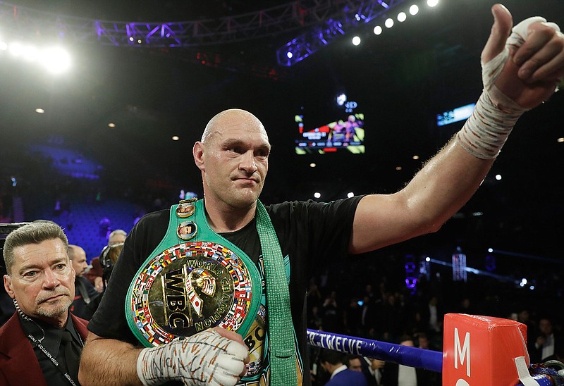 Tyson Fury of England celebrates after defeating Deontay Wilder on Saturday during a WBC heavyweight championship boxing match in Las Vegas. 