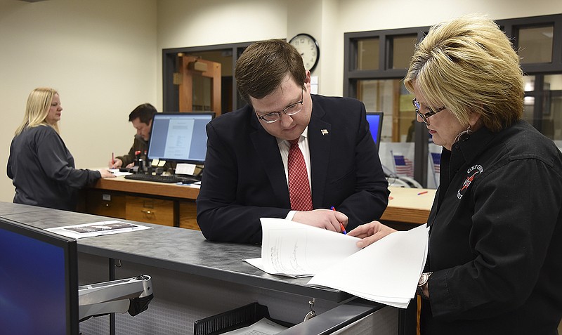 Cole County Deupty Clerk Lynne Reinkemeyer, right, assists Matt Willis, who filed Tuesday, Feb. 25, 2020, to run for the newly created associate circuit judge position, while Dawn Cremeans, also a deputy clerk, assists Rick Prather, who is running for the office of county assessor.