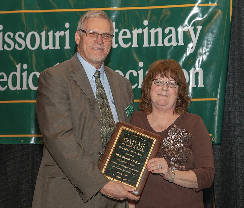 <p>Submitted</p><p>Denise Colvin received the Distinguished Service Award from the Missouri Veterinary Medical Foundation. Richard Antweiler, Missouri Veterinary Medical Association Executive Director, presented Colvin the award.</p>