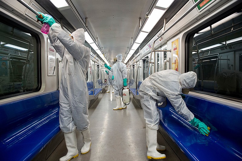Workers disinfect subway trains against coronavirus in Tehran, Iran, in the early morning of Tuesday, Feb. 25, 2020. Iran's government said Tuesday that more than a dozen people had died nationwide from the new coronavirus, rejecting claims of a much higher death toll of 50 by a lawmaker from the city of Qom that has been at the epicenter of the virus in the country. (Sajjad Safari/IIPA via AP)