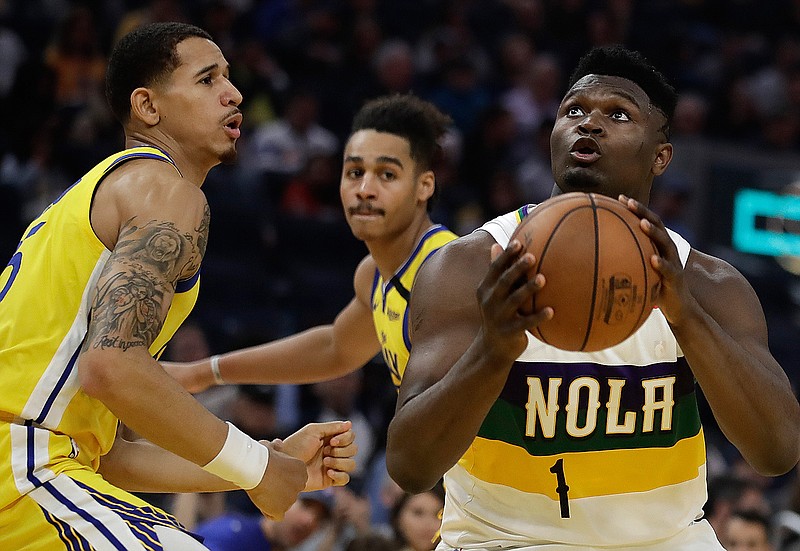 New Orleans Pelicans' Zion Williamson (1) looks to shoot against Golden State Warriors' Juan Toscano-Anderson, left, during the first half of an NBA basketball game Sunday, Feb. 23, 2020, in San Francisco. (AP Photo/Ben Margot)