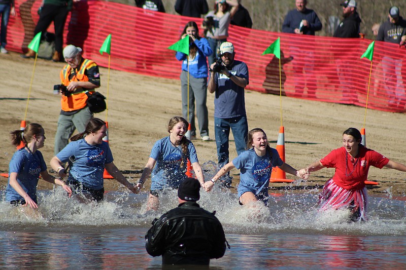 <p>Submitted</p><p>Emma Heather, Madison McCord, Lizzie Shewmake, Elly Clause and Sydney Percival take the Polar Plunge in 32 degree water Saturday afternoon.</p>