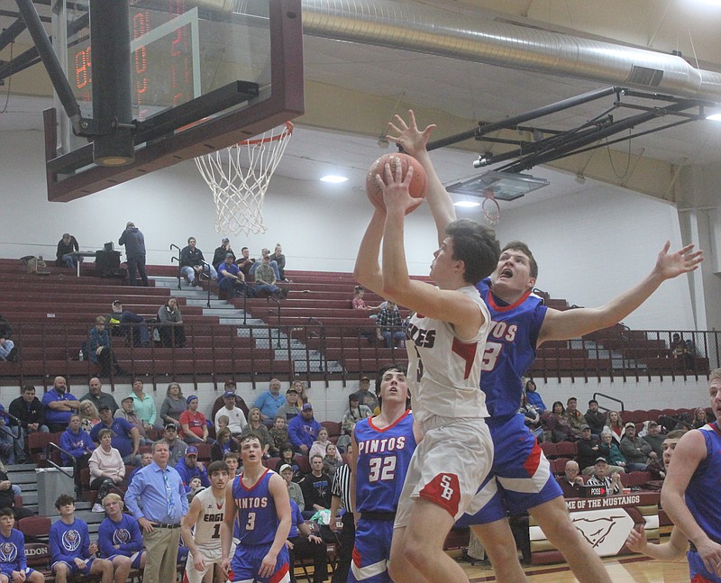 <p>Democrat photo/Kevin Labotka</p><p>Bryant Davis contests a shot Feb. 25 during the Pintos’ game against Southern Boone.</p>