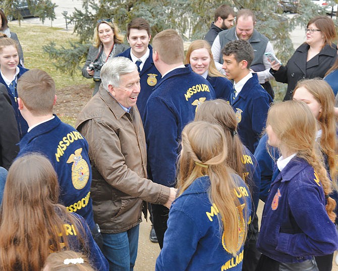 Gov. Mike Parson greets Missouri FFA students from across the state who were gathered Friday, Feb. 28, 2020, at the state Capitol for activities. Parson was joined by Lt. Gov. Mike Kehoe, and they spent the morning with more than 200 FFA students. The governor and lieutenant governor arrived driving John Deere tractors before meeting with students and posing for photographs with them. 