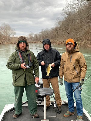(From left) Billy Smith, Clay Newcomb and Hal Herring prove winter smallmouth bass fishing can be hot when the weather is cold. 