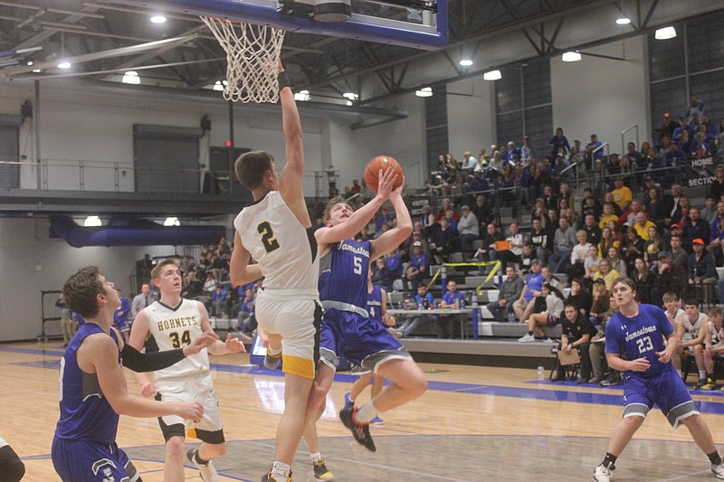 <p>Democrat photo/Kevin Labotka</p><p>Clark Rohrbach goes to the basket Feb. 29 during the Eagles’ loss to St. Elizabeth.</p>