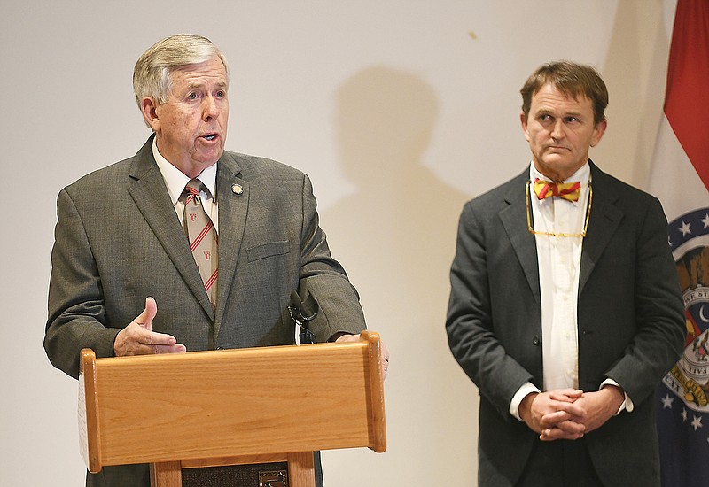 Gov. Mike Parson and Dr. Randall Williams, right, held a news conference after a meeting Tuesday, March 3, 2020, with State of Emergency Management Agency officials, external stakeholders and Missouri Cabinet members at SEMA Headquarters. Williams is director of the Division of Health and Senior Services.