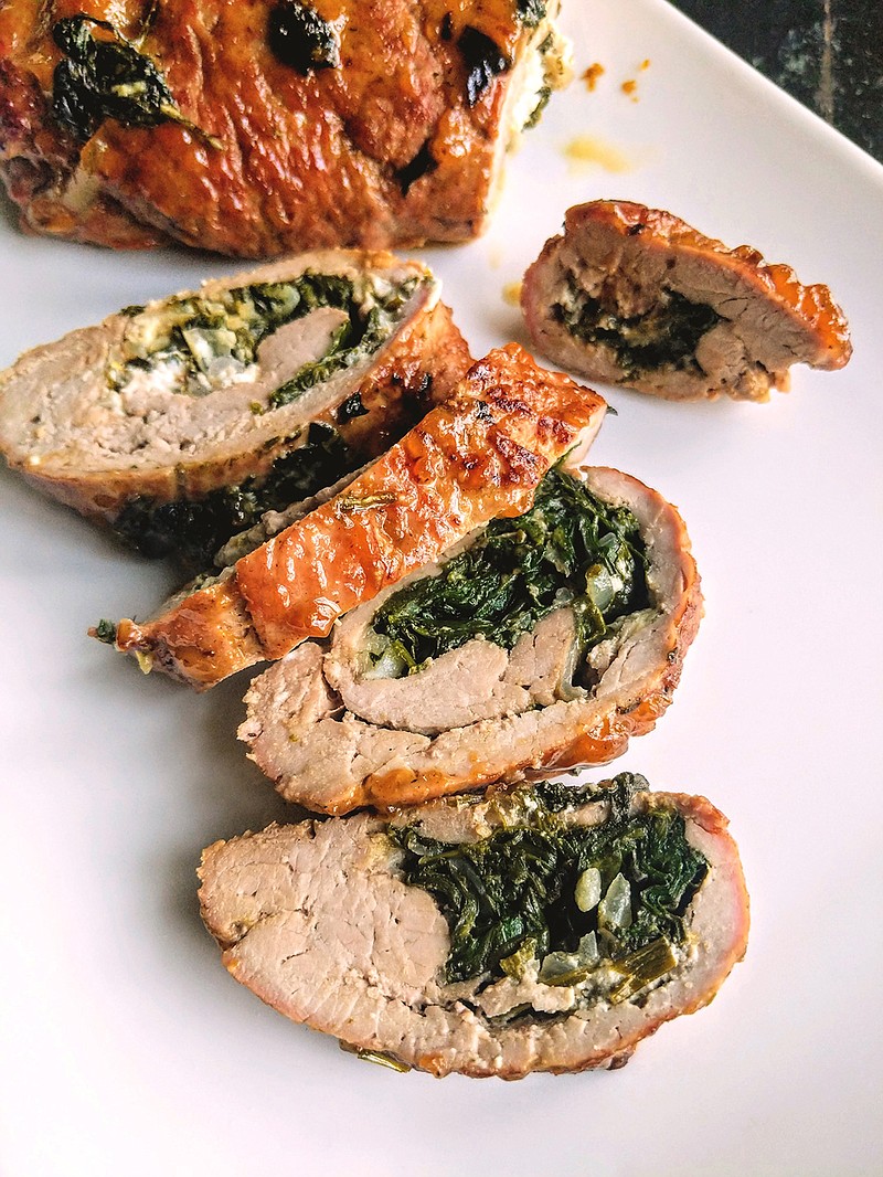 Pork loin stuffed with goat cheese and spinach is an elegant -- and easy -- weeknight meal.(Gretchen McKay/Post-Gazette/TNS)