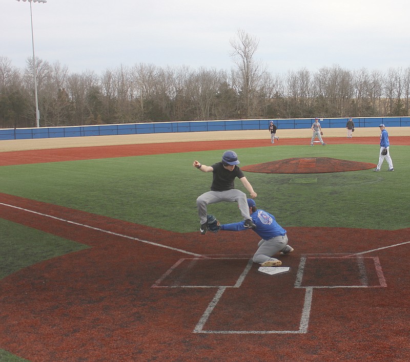 <p>Democrat photo/Kevin Labotka</p><p>California baseball players practice base running drills on March 4.</p>