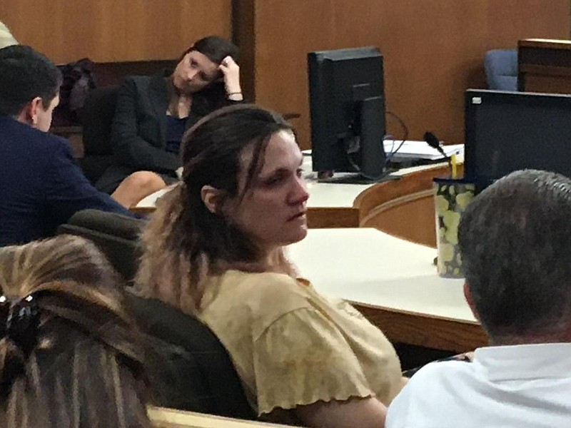 Linda Michelle "Gucci" Dooley, 38, talks to her lawyer on Thursday in court in New Boston, Texas. She was found guilty and sentenced to life in prison for human trafficking involving the prostitution of a 16-year-old girl.