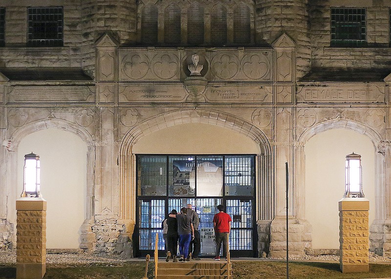 People wait for a 9 p.m. ghost tour Friday, March 6, 2020, outside the Missouri State Penitentiary. The penitentiary tours, later to be temporarily suspended again in response to the COVID-19 pandemic, had resumed for the first time since the May 2019 tornado damaged the Jefferson City property.