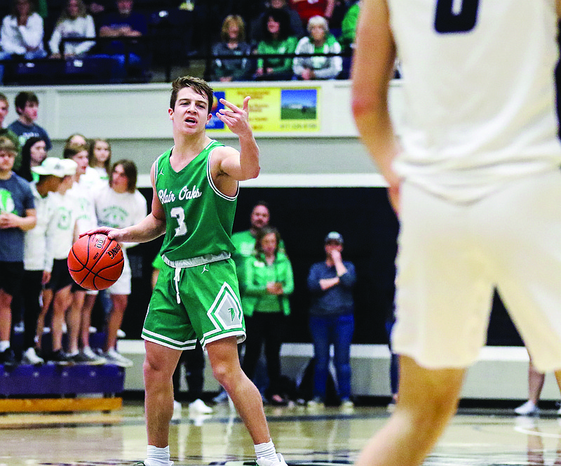 Jake Closser of Blair Oaks directs the offense during Saturday night's Class 3 quarterfinal game against Fair Grove at Southwest Baptist in Bolivar.