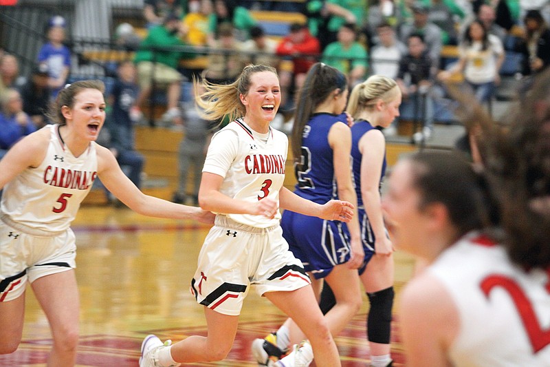 Tipton's Abby Backes (center) celebrates with her teammates after the Lady Cardinals won Saturday's Class 2 quarterfinal game against Paris at Moberly Area Community College.