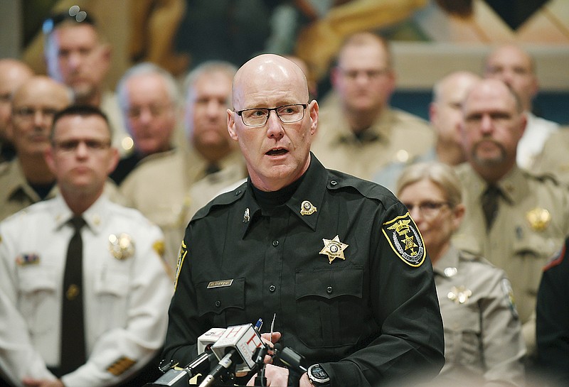 Sheriff David Parrish speaks Wednesday as the Missouri Sheriffs' Association held a press conference in the House Lounge. Cole County Sheriff John Wheeler, shown over Parrish's shoulder, was in attendance. The group, of which Parrish serves as president, addressed the media about issues affecting all counties in the state. The day's activities drew 48 sheriffs to the Capitol in an effort to impress on legislators the importance of necessary changes or updates to legislation and reimbursement rates for housing or holding inmates.