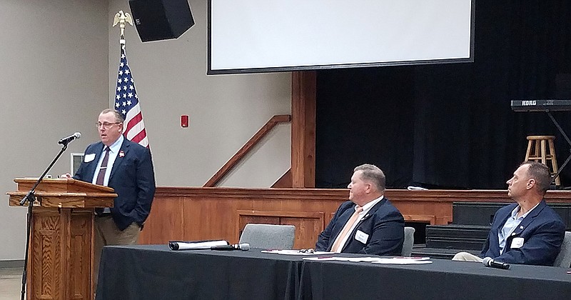 Michael Lee, left, director of engineering and safety operations for the Texas Department of Transportation, speaks as Brian Taylor, center, chief engineer for the Oklahoma Department of Transportation, and Steve Frisbee, district engineer for the Arkansas Department of Transportation, listen March 13, 2020, at Williams Memorial United Methodist Church in Texarkana, Texas. The panel spoke during the quarterly meeting of TEX-21, an organization that advocates for transportation improvements.