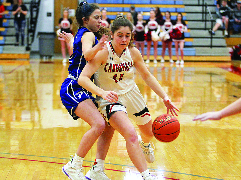 Tipton's Alexa Jurgensmeyer dribbles the ball past Delaney Wheelan of Paris during last Saturday's Class 2 quarterfinal game at Moberly Area Community College.