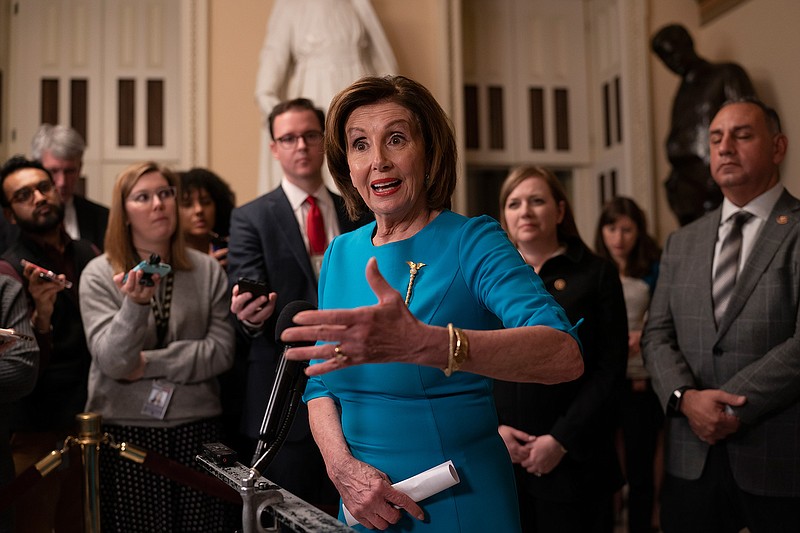 Speaker of the House Nancy Pelosi, D-Calif., makes a statement ahead of a planned late-night vote on the coronavirus aid package deal at the Capitol in Washington, Friday, March 13, 2020. (AP Photo/J. Scott Applewhite)