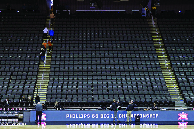 Fans leave the Sprint Center after the remaining games in the Big 12 Conference tournament were canceled due to concerns about the coronavirus Thursday in Kansas City.