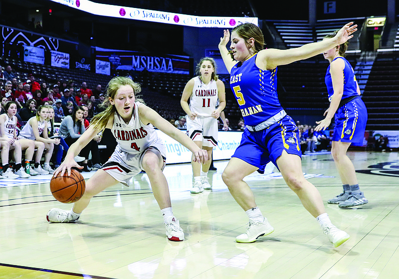Myra Claas of Tipton is defended by Dawn Potter of East Buchanan near the baseline during Saturday afternoon's Class 2 state championship game at JQH Arena in Springfield.