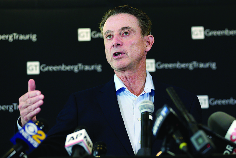 In this Feb. 21, 2018, file photo, Rick Pitino speaks during a news conference in New York. 