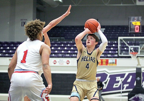 Malcolm Davis of Helias takes a shot against Webb City during the first half of Saturday's Class 4 quarterfinal game at Southwest Baptist in Bolivar.