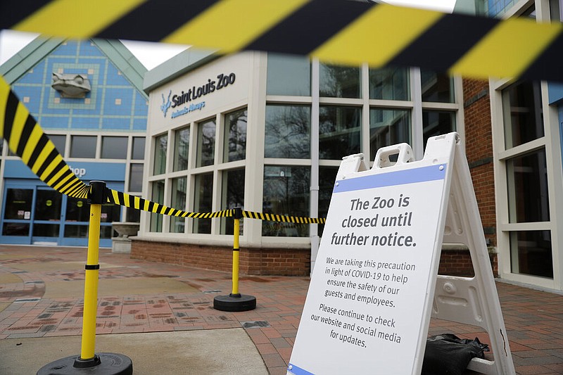 A sign informs visitors that the Saint Louis Zoo is temporarily closed to the public to protect against the spread of coronavirus Monday, March 16, 2020, in St. Louis. (AP Photo/Jeff Roberson)