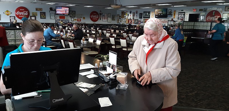  Tuesday's lunchtime crowd at Dixie Diner in Nash, Texas, was noticeably quieter, as compared to the usual bustling rush owner Mike Morris serves during that time of day. Morris says that, at least for now, COVID-19 talk and activity has put pressure on his business.