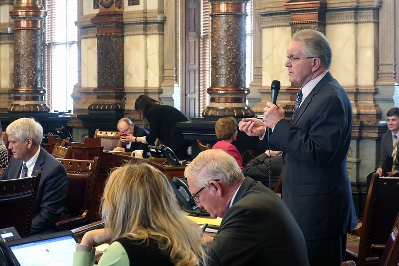 Kansas State Sen. Mike Thompson, R-Shawnee, speaks in favor of a proposal to curb Democratic Gov. Laura Kelly's power to address the coronavirus pandemic. Thompson and other conservatives argue that Kelly overreacted when she closed the state's K-12 schools for the rest of the spring semester. (AP Photo/John Hanna)