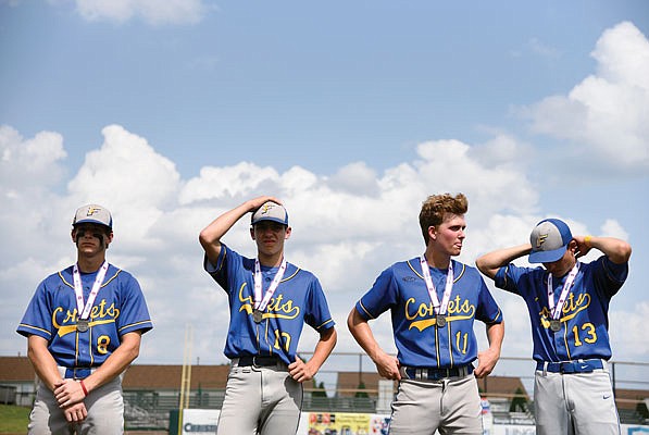 Four members of the Fatima Comets stand with their Class 3 second-place medals around their necks after falling to Blair Oaks in the state title game last season in O'Fallon. Fatima is ranked No. 1 in the preseason Class 3 poll by the Missouri High School Baseball Coaches Association.