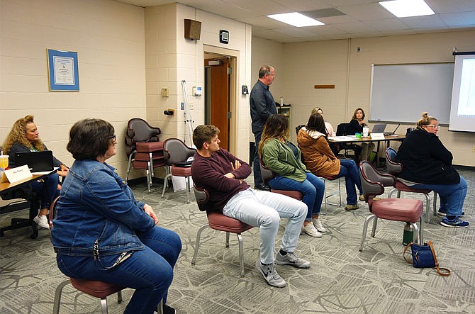 The crowd at Tuesday evening's New Bloomfield Board of Education meeting was sparse and well-spaced. Board members voted to pay all employees during the school closure. This includes both teachers and non-certified staff such as paraprofessionals, janitors, secretaries and bus drivers.