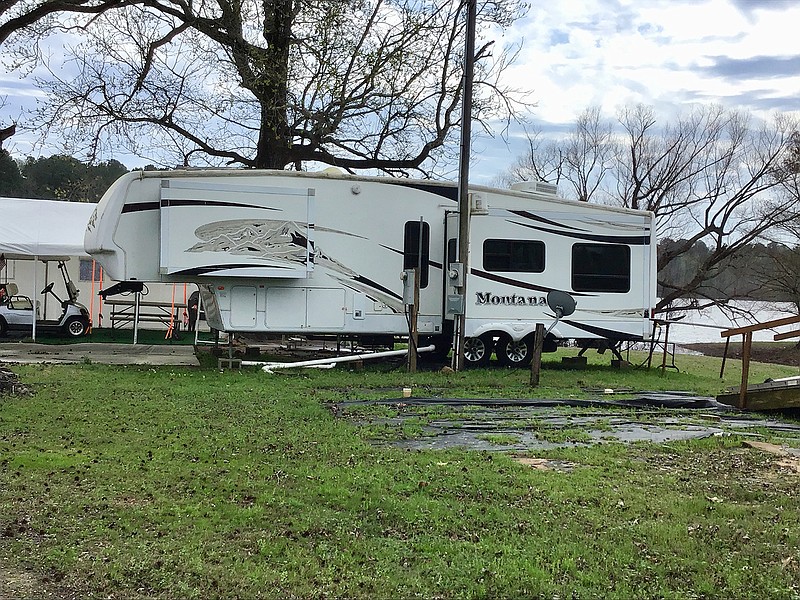 A camper that sits next to Wright Patman Lake provides shelter for a pair of campers during the spring season. The coronavirus has not affected camping at Kelly Creek Landing in Maud, Texas. As of presstime, the U.S. Army Corps of Engineers has not postponed the opening of campgrounds around Wright Patmam Lake. 
