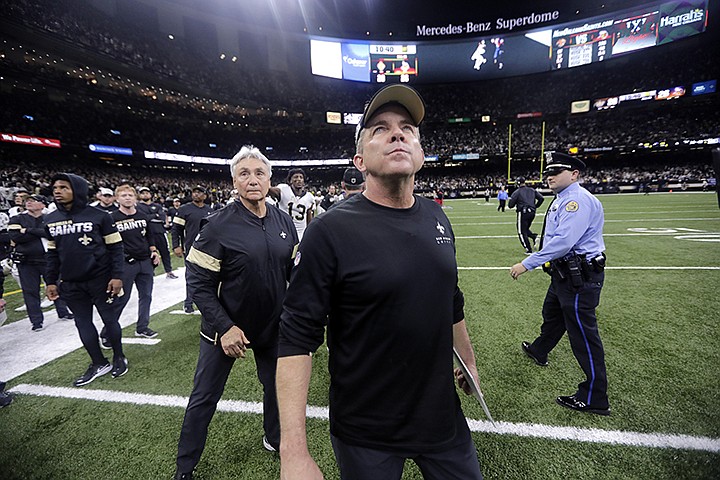 New Orleans Saints head coach Sean Payton looks up as he walks off the field after overtime of an NFL wild-card playoff football game against the Minnesota Vikings, Sunday, Jan. 5, 2020, in New Orleans. The Vikings won 26-20. (AP Photo/Brett Duke)