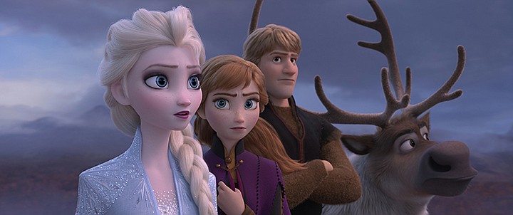 This image released by Disney shows Elsa, voiced by Idina Menzel, from left, Anna, voiced by Kristen Bell, Kristoff, voiced by Jonathan Groff and Sven in a scene from the animated film, "Frozen 2." The Walt Disney Co. put the box-office hit on its Disney Plus streaming service three months earlier than planned, "surprising families with some fun and joy during this challenging period." (Disney via AP)