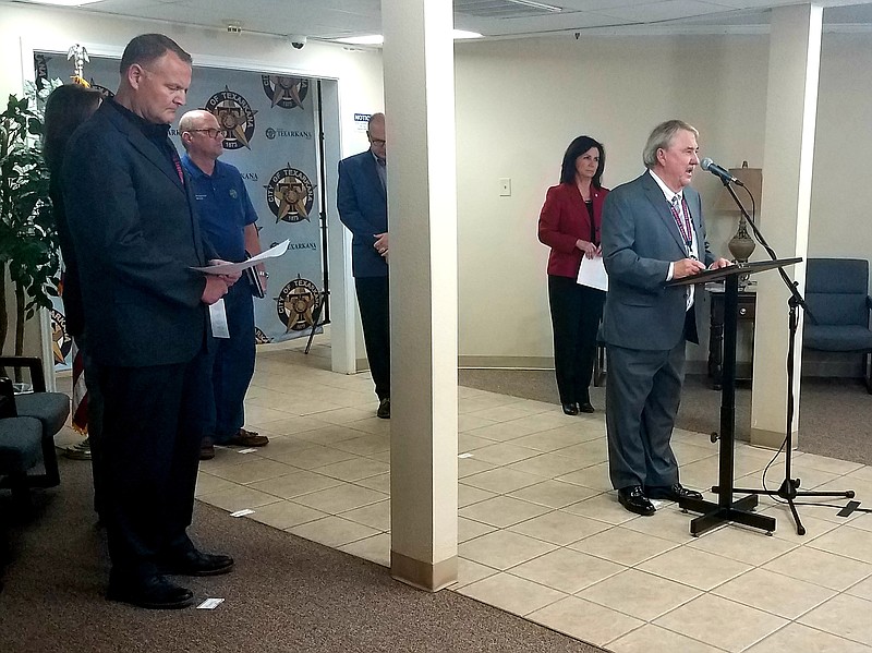 Bowie County Judge Bobby Howell speaks at a media briefing about the coronavirus epidemic Friday, March 20, 2020, at the Ark-Tex Council of Governments offices in Texarkana, Texas. Elected officials from Miller County, Arkansas; Cass County, Texas; and both cities of Texarkana look on.