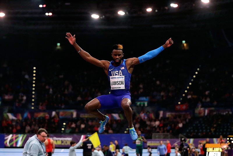 In this March 2, 2018, file photo, United States' Jarrion Lawson makes an attempt in the men's long jump final at the World Athletics Indoor Championships in Birmingham, Britain. The agent for Lawson says the American long jumper has been cleared by the Court of Arbitration for Sport in a doping offense involving tainted beef. Paul Doyle says Lawson is eligible to compete effective immediately. (AP Photo/Matt Dunham, File)