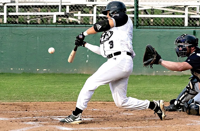 Texarkana Twins' Shea Gutierrez makes contact with the ball to send it into the outfield against the Brazos Valley Bombers during a 2019 game at George Dobson Field in Texarkana, Texas. 
