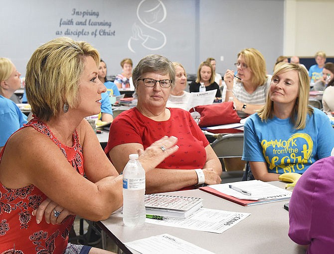 Kay Heckman, seated at left, talks during a suicide prevention seminar in 2019. Heckman spoke Wednesday, March 18, 2020, to Fulton Rotary Club via videoconferencing.