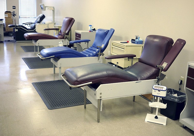 FILE - This Monday, March 9, 2020 file photo shows empty blood donation seats at The American Red Cross donation center in Scranton, Pa. Due to the flu season and new coronavirus, donations to The American Red Cross are down across the country. (Jake Danna Stevens/The Times-Tribune via AP)