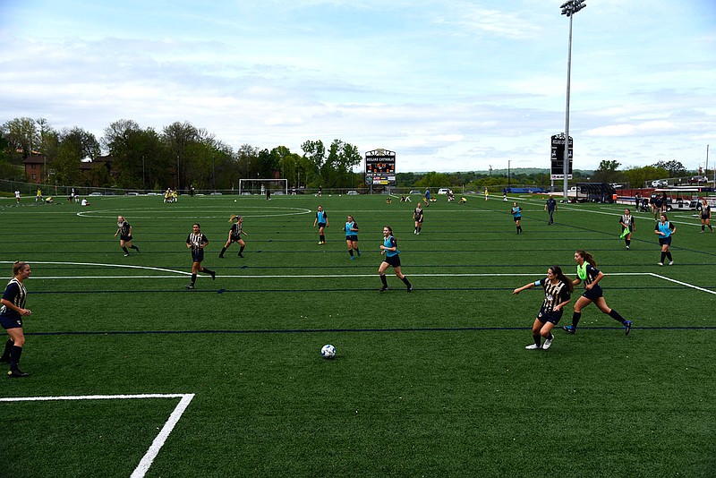 The Helias Lady Crusader soccer team warms up before beginning their game against St. Jospeh's Academy last season at the Crusader Athletic Complex.