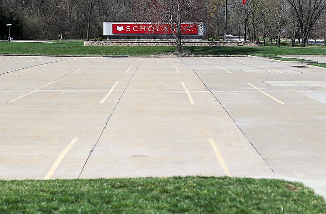 The parking lot of Scholastic, Inc. is empty Saturday on Stertzer Road.