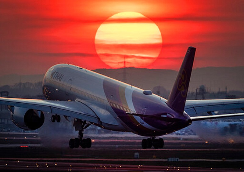 An Airbus A 350 from Thai Airways lands on March 17 at the airport in Frankfurt, Germany, as the sun sets. Travel insurance can be a good investment if you have medical issues or you're traveling to a volatile region, experts say. But it has its limits, as many travelers whose plans are affected by coronavirus have found out.   


