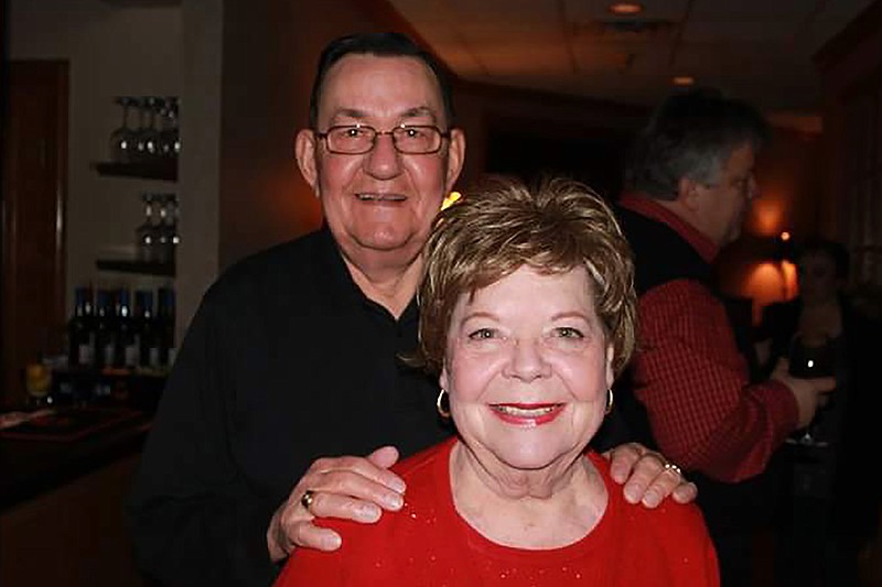 In this 2011 family photo provided by Dawn Bouska, Charles Recka and his wife, Patricia Recka, pose for a photo at a banquet in Naperville, Ill. Charles Recka died on March 12, 2020. Deep into the obituary for 87-year-old Recka is the short announcement that "a Mass Celebrating his life will be held at a later date," a quiet signal popping up in death notices all over the country that the coronavirus that's changed everything about our lives has dramatically changed the way we grieve for the dead, too. (Courtesy of Dawn Bouska via AP)